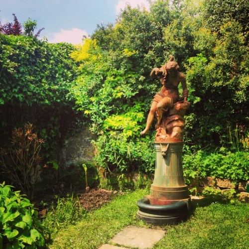 A statue in the formal gardens at Groombridge Place 