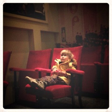 little-boy-sitting-in-old-fashioned-cinema