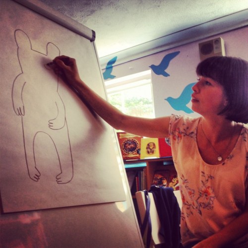 a-woman-drawing-a-bear