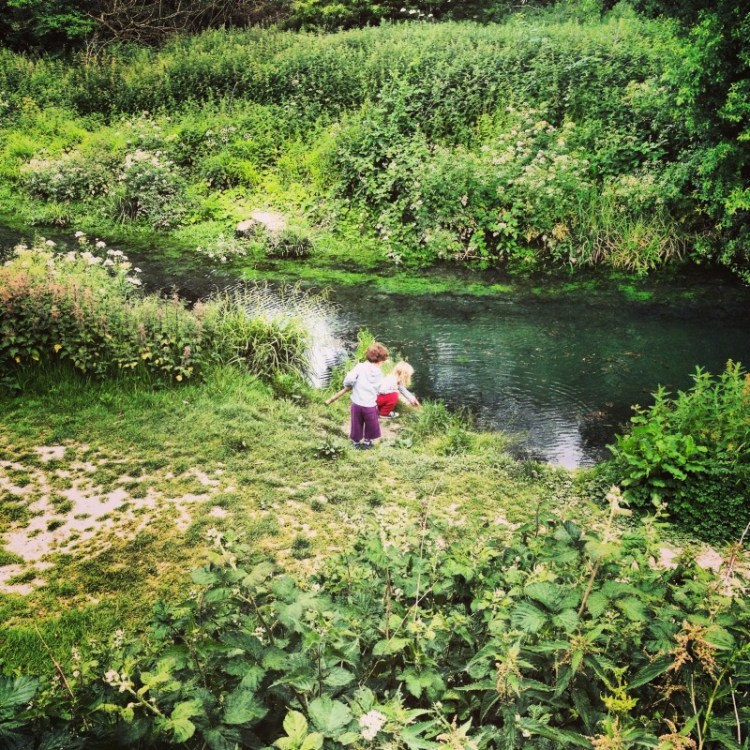 children-looking-at-a-river