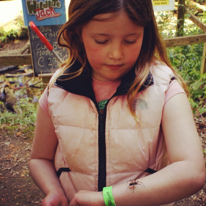 child-holding-spider