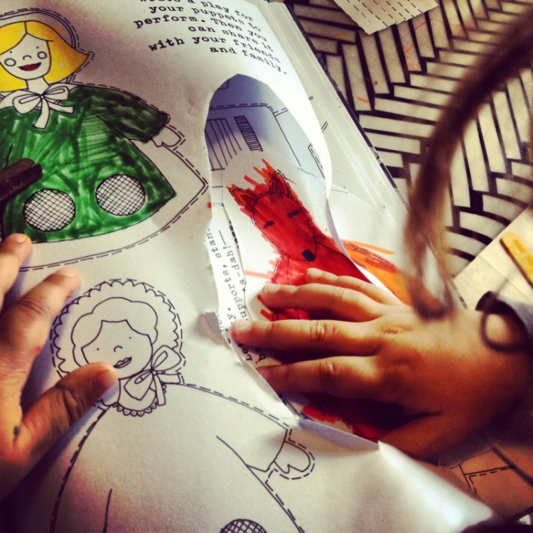 Paper puppetry by Lydia Crook child-cutting-out-paper-puppets